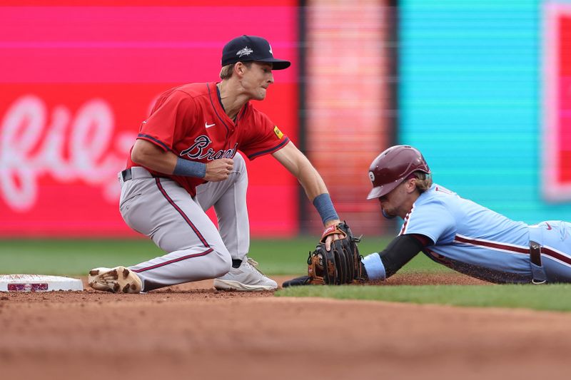 May 29, 2025; Philadelphia, Pennsylvania, USA; Atlanta Braves shortstop Luke Williams (37) tags out Philadelphia Phillies second base Bryson Stott (5) on a stolen base attempt during the third inning at Citizens Bank Park. Mandatory Credit: Bill Streicher-Imagn Images