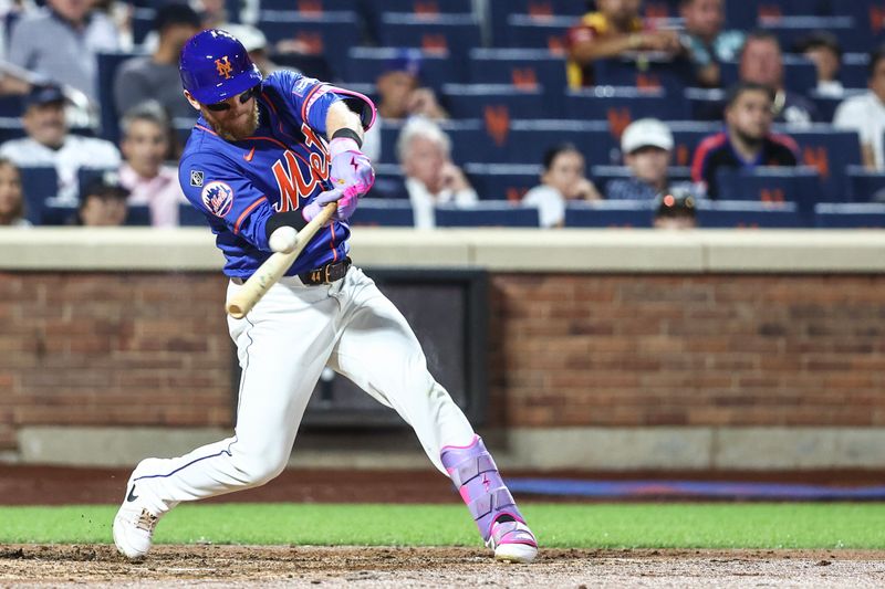 Jun 26, 2024; New York City, New York, USA;  New York Mets center fielder Harrison Bader (44) hits an RBI double in the fifth inning against the New York Yankees at Citi Field. Mandatory Credit: Wendell Cruz-USA TODAY Sports