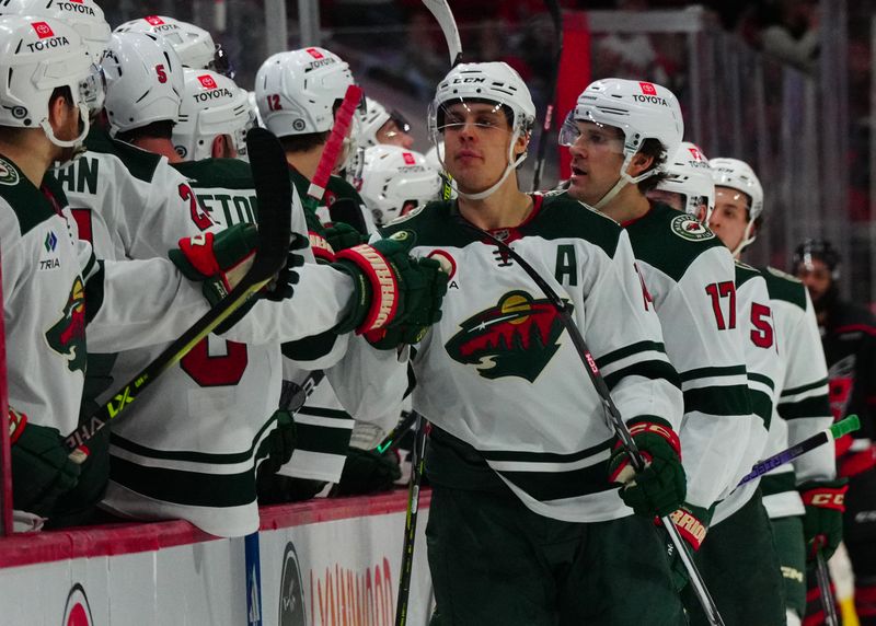 Jan 21, 2024; Raleigh, North Carolina, USA;  Minnesota Wild center Joel Eriksson Ek (14) celebrates his goal against the Carolina Hurricanes during the third period at PNC Arena. Mandatory Credit: James Guillory-USA TODAY Sports