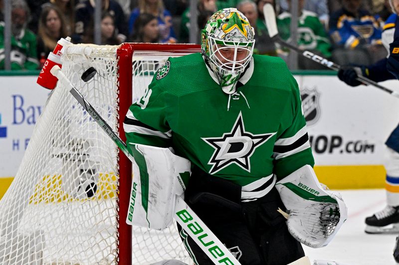 Apr 17, 2024; Dallas, Texas, USA; Dallas Stars goaltender Jake Oettinger (29) makes a blocker save on a shot by the St. Louis Blues during the first period at the American Airlines Center. Mandatory Credit: Jerome Miron-USA TODAY Sports