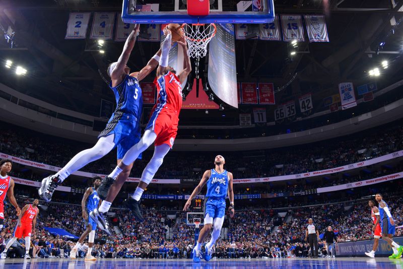 PHILADELPHIA, PA - APRIL 12: Trevelin Queen #12 of the Orlando Magic drives to the basket during the game against the Orlando Magic on April 12, 2024 at the Wells Fargo Center in Philadelphia, Pennsylvania NOTE TO USER: User expressly acknowledges and agrees that, by downloading and/or using this Photograph, user is consenting to the terms and conditions of the Getty Images License Agreement. Mandatory Copyright Notice: Copyright 2024 NBAE (Photo by Jesse D. Garrabrant/NBAE via Getty Images)