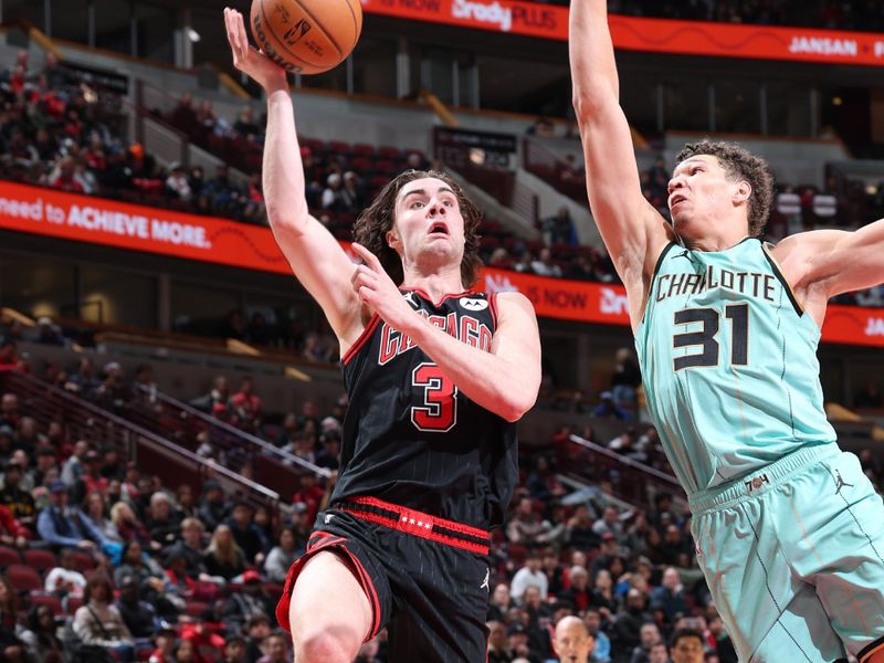 CHICAGO, IL - DECEMBER 13: Josh Giddey #3 of the Chicago Bulls drives to the basket during the game against the Charlotte Hornets on December 13, 2024 at United Center in Chicago, Illinois. NOTE TO USER: User expressly acknowledges and agrees that, by downloading and or using this photograph, User is consenting to the terms and conditions of the Getty Images License Agreement. Mandatory Copyright Notice: Copyright 2024 NBAE (Photo by Jeff Haynes/NBAE via Getty Images)