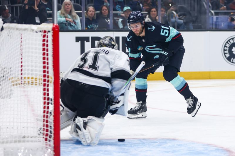 Dec 10, 2025; Seattle, Washington, USA;  Seattle Kraken center Shane Wright (51) takes a shot at goal in the first period against the Los Angeles Kings at Climate Pledge Arena. Mandatory Credit: Kevin Ng-Imagn Images