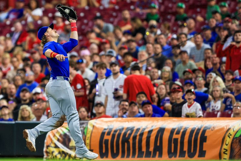 Jul 31, 2024; Cincinnati, Ohio, USA; Chicago Cubs first baseman Patrick Wisdom (16) catches a pop up hit by Cincinnati Reds shortstop Elly De La Cruz (not pictured) in the sixth inning at Great American Ball Park. Mandatory Credit: Katie Stratman-USA TODAY Sports