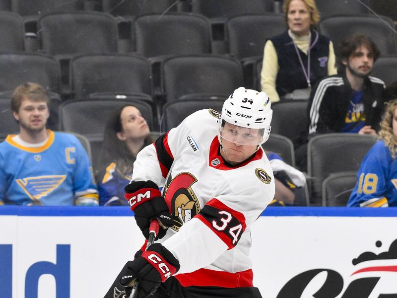 Oct 2, 2025; St. Louis, Missouri, USA; Ottawa Senators right wing Arthur Kaliyev (34) shoots against the St. Louis Blues during the third period at Enterprise Center. Mandatory Credit: Jeff Curry-Imagn Images