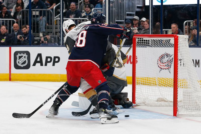 Mar 4, 2024; Columbus, Ohio, USA; Columbus Blue Jackets center Boone Jenner (38) reaches for the rebound of a Vegas Golden Knights goalie Adin Hill (33) save during the second period at Nationwide Arena. Mandatory Credit: Russell LaBounty-USA TODAY Sports