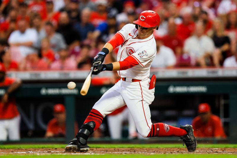 Sep 18, 2024; Cincinnati, Ohio, USA; Cincinnati Reds outfielder TJ Friedl (29) hits a single in the fourth inning against the Atlanta Braves at Great American Ball Park. Mandatory Credit: Katie Stratman-Imagn Images