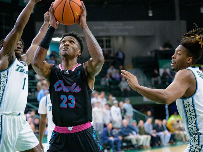 Jan 11, 2024; New Orleans, Louisiana, USA; Florida Atlantic Owls guard Brandon Weatherspoon (23) shoots against Tulane Green Wave guard Sion James (1) during the first half at Avron B. Fogelman Arena in Devlin Fieldhouse. Mandatory Credit: Matthew Hinton-USA TODAY Sports