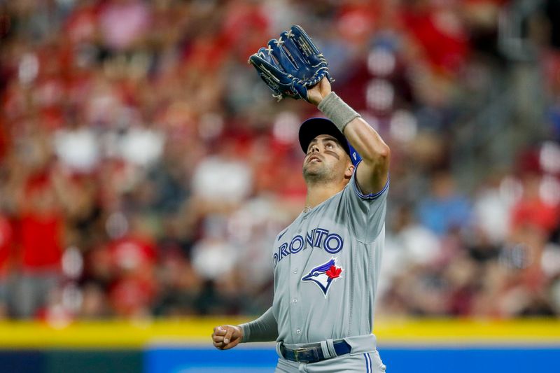 Aug 19, 2023; Cincinnati, Ohio, USA; Toronto Blue Jays right fielder Whit Merrifield (15) catches a pop up hit in the ninth inning at Great American Ball Park. Mandatory Credit: Katie Stratman-USA TODAY Sports