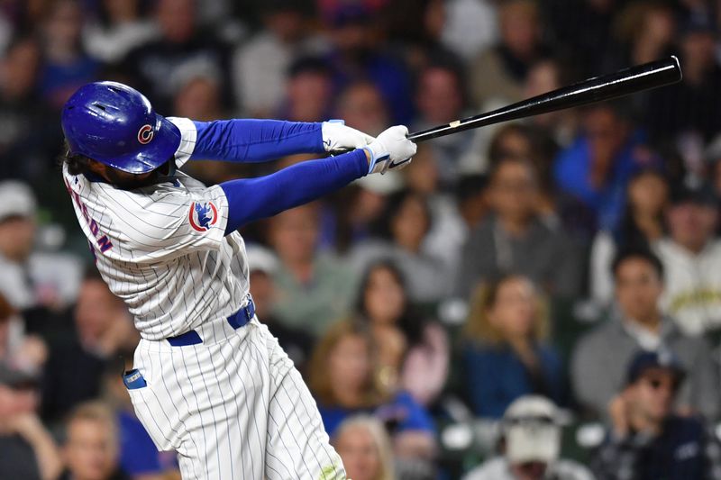 Aug 20, 2024; Chicago, Illinois, USA; Chicago Cubs shortstop Dansby Swanson (7) hits a home run during the sixth inning against the Detroit Tigers at Wrigley Field. Mandatory Credit: Patrick Gorski-USA TODAY Sports