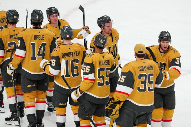 Dec 6, 2024; Las Vegas, Nevada, USA; Vegas Golden Knights right wing Victor Olofsson (95)  right wing Mark Stone (61), and defenseman Brayden McNabb (3) celebrate with teammates after the Golden Knights defeated the Dallas Stars 3-2 at T-Mobile Arena. Mandatory Credit: Stephen R. Sylvanie-Imagn Images