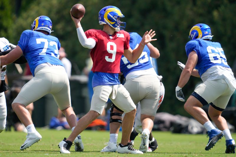 Los Angeles Rams quarterback Matthew Stafford (9) prepares to throw during a joint practice with the Cincinnati Bengals at the team's NFL football training facility, Wednesday, Aug. 24, 2022, in Cincinnati. (AP Photo/Jeff Dean)