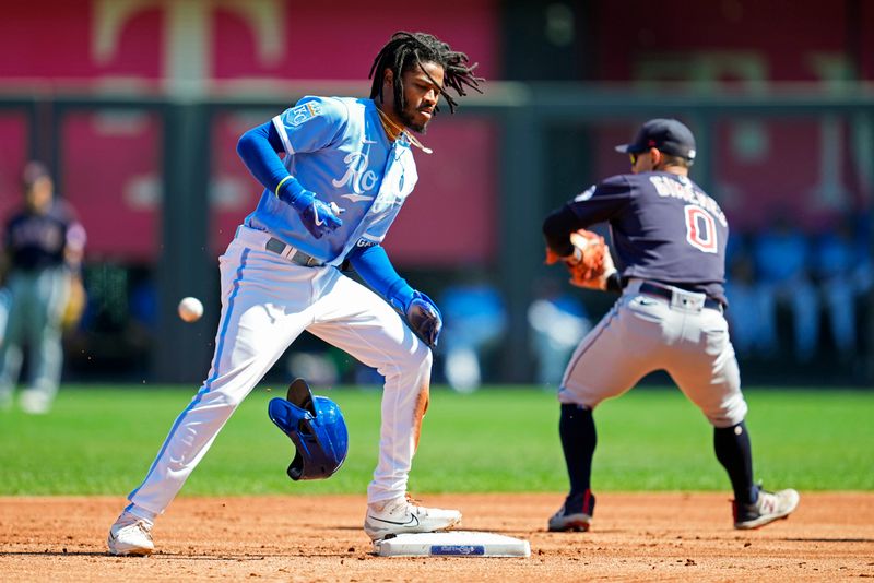 Sep 20, 2023; Kansas City, Missouri, USA; Kansas City Royals third baseman Maikel Garcia (11) loses his helmet after sliding into second base for a double against the Cleveland Guardians during the first inning at Kauffman Stadium. Mandatory Credit: Jay Biggerstaff-USA TODAY Sports