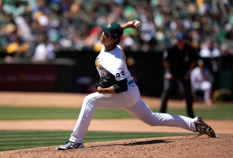 Jun 18, 2023; Oakland, California, USA; Oakland Athletics pitcher Shintaro Fujinami (11) during the seventh inning at Oakland-Alameda County Coliseum. Mandatory Credit: D. Ross Cameron-USA TODAY Sports