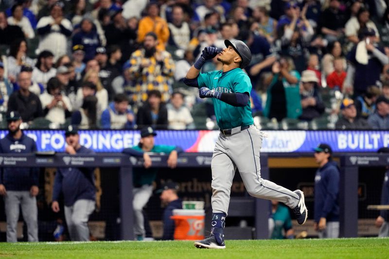 Apr 6, 2024; Milwaukee, Wisconsin, USA;  Seattle Mariners second baseman Jorge Polanco (7) celebrates after hitting a home run during the eighth inning against the Milwaukee Brewers at American Family Field. Mandatory Credit: Jeff Hanisch-USA TODAY Sports