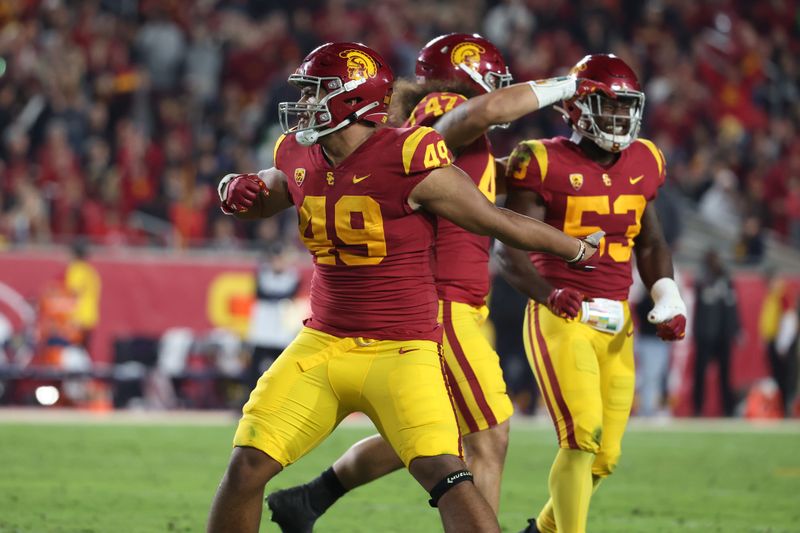 Nov 5, 2022; Los Angeles, California, USA;  USC Trojans defensive lineman Tuli Tuipulotu (49) reacts after a play during the second quarter against the California Golden Bears at United Airlines Field at Los Angeles Memorial Coliseum. Mandatory Credit: Kiyoshi Mio-USA TODAY Sports