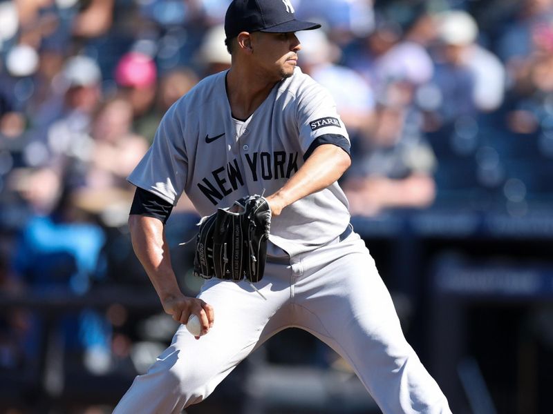 Apr 19, 2025; Tampa, Florida, USA; New York Yankees starting pitcher Carlos Carrasco (59) throws a pitch against the Tampa Bay Rays in the first inning at George M. Steinbrenner Field. Mandatory Credit: Nathan Ray Seebeck-Imagn Images