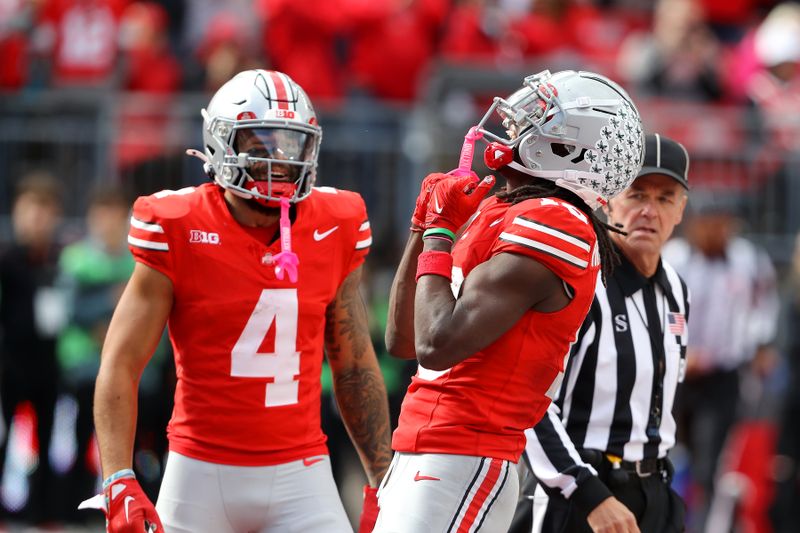 Oct 7, 2023; Columbus, Ohio, USA;  Ohio State Buckeyes wide receiver Marvin Harrison Jr. (18) celebrates his touchdown catch with wide receiver Julian Fleming (4) during the fourth quarter against the Maryland Terrapins at Ohio Stadium. Mandatory Credit: Joseph Maiorana-USA TODAY Sports