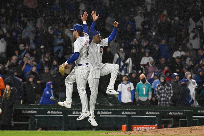 Apr 2, 2024; Chicago, Illinois, USA; Chicago Cubs third baseman Christopher Morel (5)  and Chicago Cubs second baseman Nico Hoerner (2) after the game against the Colorado Rockies  at Wrigley Field. Mandatory Credit: Matt Marton-USA TODAY Sports