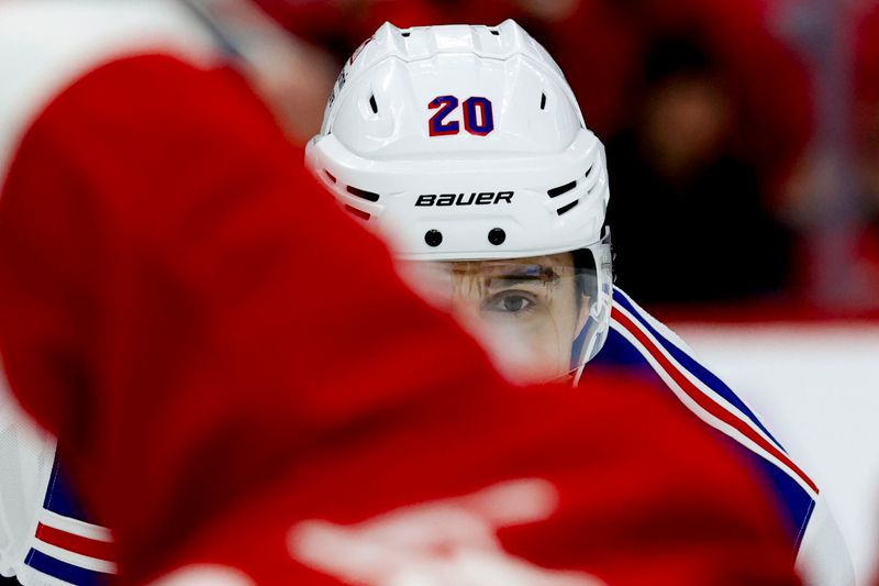 Nov 9, 2024; Detroit, Michigan, USA;  New York Rangers left wing Chris Kreider (20) gets set during a face off against the Detroit Red Wings in the first period at Little Caesars Arena. Mandatory Credit: Rick Osentoski-Imagn Images