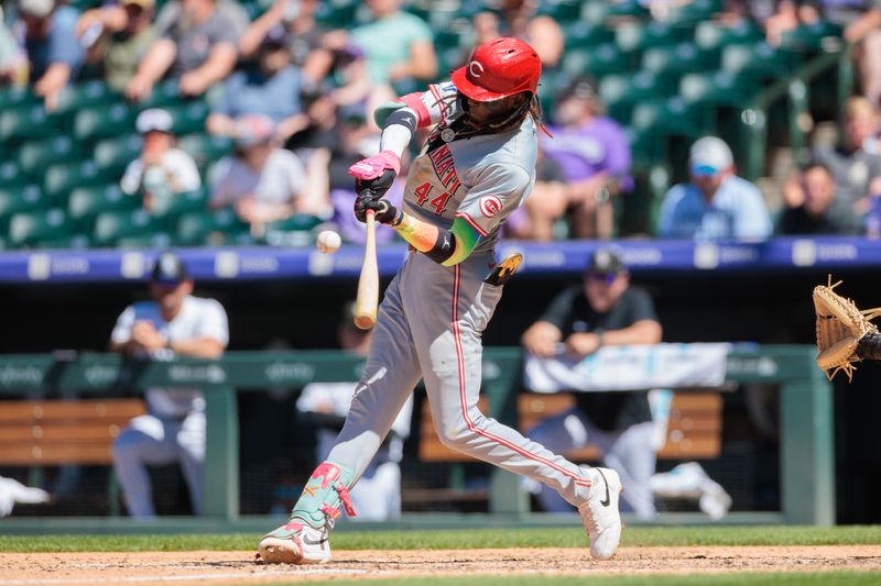 Jun 5, 2024; Denver, Colorado, USA; Cincinnati Reds shortstop Elly De La Cruz (44) hits an RBI single during the seventh inning against the Colorado Rockies at Coors Field. Mandatory Credit: Andrew Wevers-USA TODAY Sports