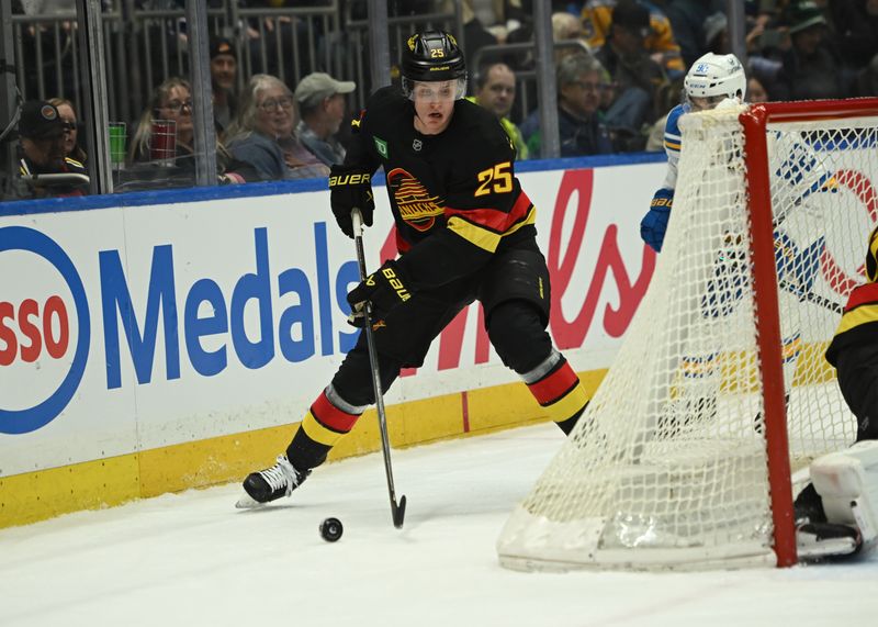 Mar 21, 2026; Vancouver, British Columbia, CAN; Vancouver Canucks defenseman Elias Pettersson (25) skates with the puck against St. Louis Blues left wing Jonathan Drouin (92) during the first period at Rogers Arena. Mandatory Credit: Simon Fearn-Imagn Images