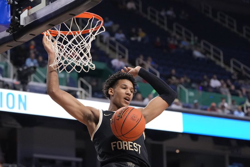 Mar 8, 2023; Greensboro, NC, USA; Wake Forest Demon Deacons forward Bobi Klintman (34) scores in the first half of the second round at Greensboro Coliseum. Mandatory Credit: Bob Donnan-USA TODAY Sports