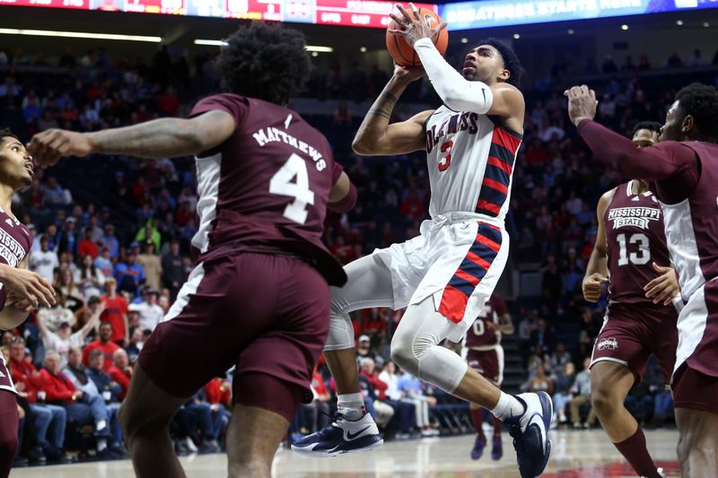 Feb 18, 2023; Oxford, Mississippi, USA; Mississippi Rebels forward Myles Burns (3) shoots during overtime against the Mississippi State Bulldogs at The Sandy and John Black Pavilion at Ole Miss. Mandatory Credit: Petre Thomas-USA TODAY Sports