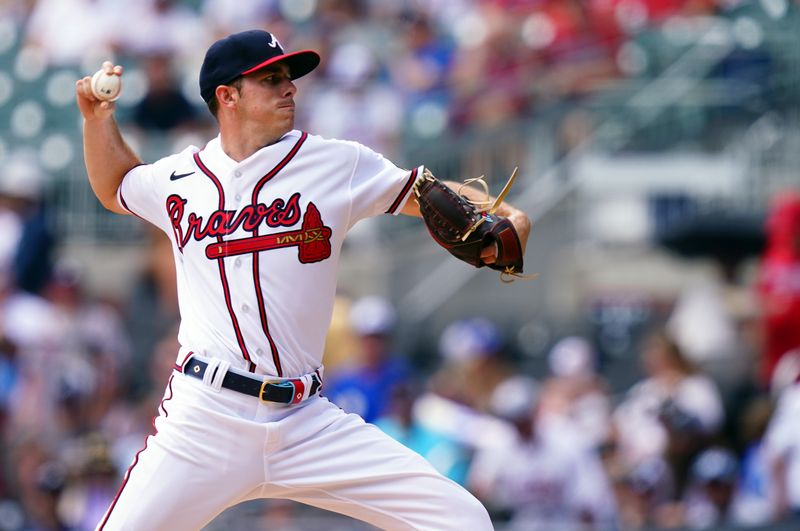 Sep 10, 2023; Cumberland, Georgia, USA; Atlanta Braves pitcher Allan Winans (72) cycles through a pitch against the Pittsburgh Pirates during the first inning at Truist Park. Mandatory Credit: John David Mercer-USA TODAY Sports