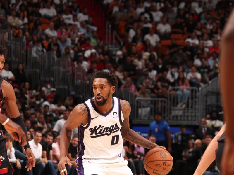 MIAMI, FL - NOVEMBER 4: Malik Monk #0 of the Sacramento Kings dribbles the ball during the game against the Miami Heat  during a regular season game on November 4, 2024 at Kaseya Center in Miami, Florida. NOTE TO USER: User expressly acknowledges and agrees that, by downloading and or using this Photograph, user is consenting to the terms and conditions of the Getty Images License Agreement. Mandatory Copyright Notice: Copyright 2024 NBAE (Photo by Issac Baldizon/NBAE via Getty Images)