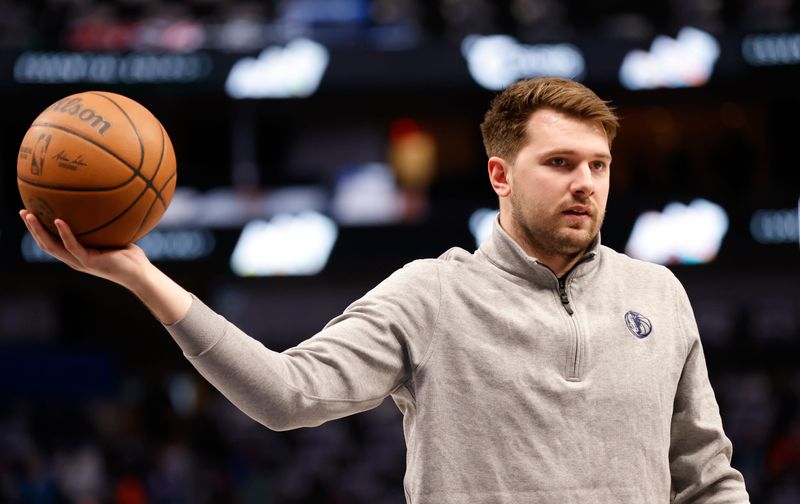 DALLAS, TX - APRIL 04: Luka Doncic #77 of the Dallas Mavericks handles the ball during warms up before the game against the Atlanta Hawks at American Airlines Center on April 4, 2024 in Dallas, Texas. NOTE TO USER: User expressly acknowledges and agrees that, by downloading and or using this photograph, User is consenting to the terms and conditions of the Getty Images License Agreement. (Photo by Ron Jenkins/Getty Images)