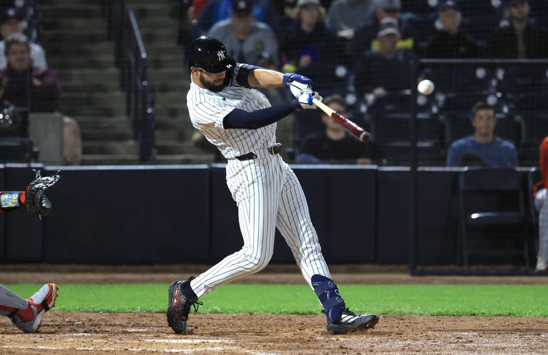 Feb 25, 2026; Tampa, Florida, USA; New York Yankees second baseman Jonathan Ornelas (64) hits an RBI single during the fourth inning against the Washington Nationals at George M. Steinbrenner Field. Mandatory Credit: Kim Klement Neitzel-Imagn Images