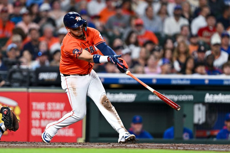 Jun 27, 2025; Houston, Texas, USA; Houston Astros third base Isaac Paredes (15) swings and looses his bat in the second inning against the Chicago Cubs at Daikin Park. Mandatory Credit: Maria Lysaker-Imagn Images 