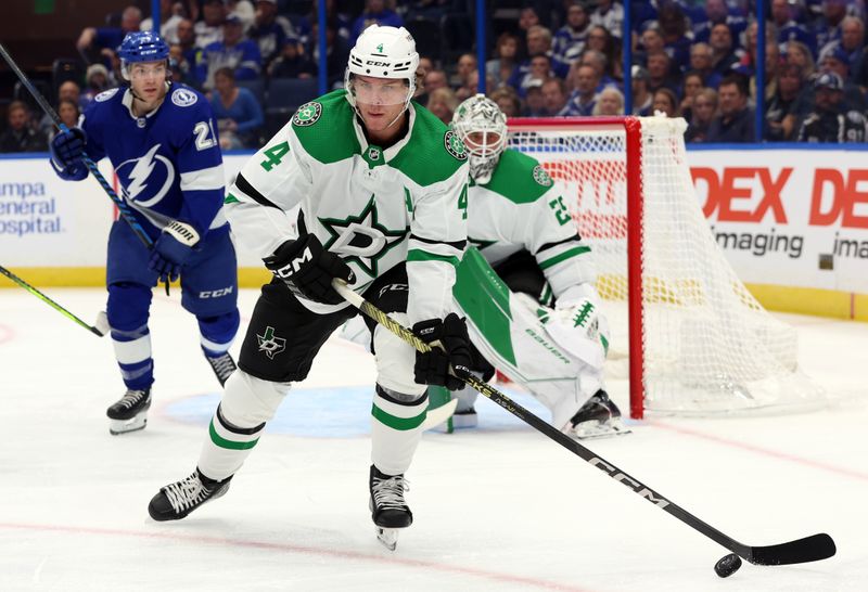 Dec 4, 2023; Tampa, Florida, USA; Dallas Stars defenseman Miro Heiskanen (4) passes the puck against the Tampa Bay Lightning during the first period at Amalie Arena. Mandatory Credit: Kim Klement Neitzel-USA TODAY Sports