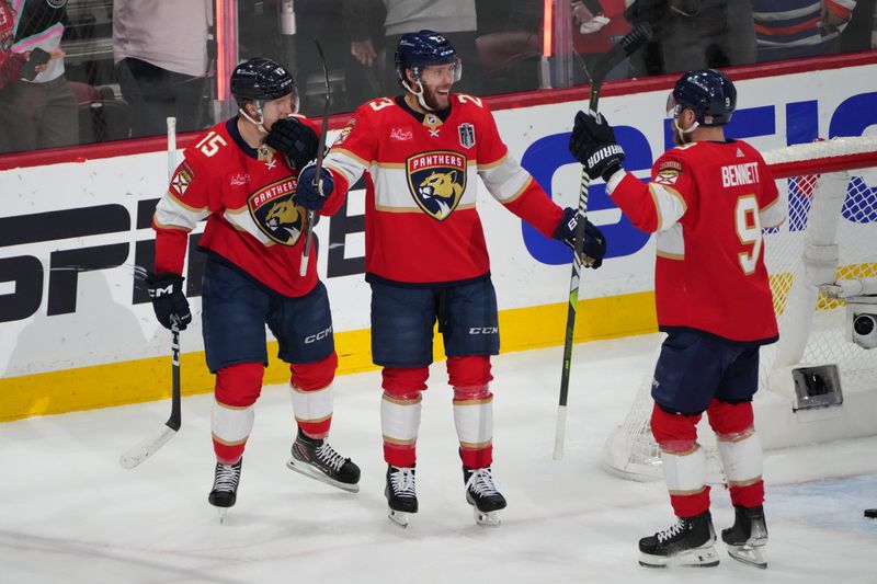 Jun 24, 2024; Sunrise, Florida, USA; Florida Panthers forward Carter Verhaeghe (23) celebrates scoring with forward Anton Lundell (15) and forward Sam Bennett (9) against Edmonton Oilers goaltender Skinner Stuart (74) during the first period in game seven of the 2024 Stanley Cup Final at Amerant Bank Arena. Mandatory Credit: Jim Rassol-USA TODAY Sports