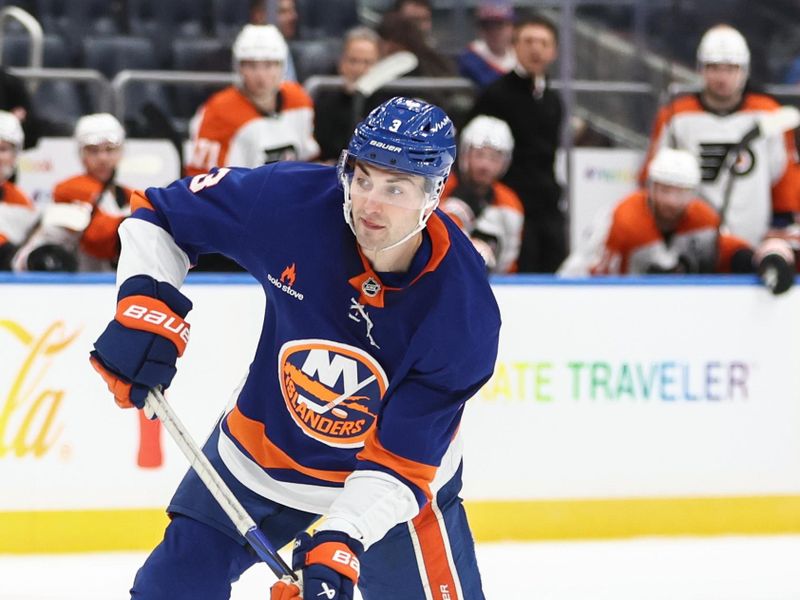 Jan 16, 2025; Elmont, New York, USA;  New York Islanders defenseman Adam Pelech (3) attempts a shot on goal in the second period against the Philadelphia Flyers at UBS Arena. Mandatory Credit: Wendell Cruz-Imagn Images