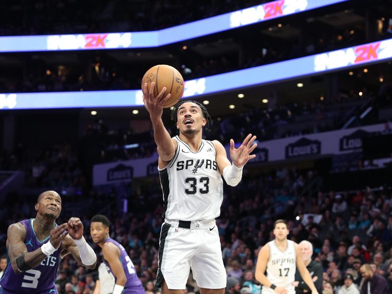 CHARLOTTE, NC - JANUARY 19: Tre Jones #33 of the San Antonio Spurs drives to the basket during the game against the Charlotte Hornets on January 19, 2024 at Spectrum Center in Charlotte, North Carolina. NOTE TO USER: User expressly acknowledges and agrees that, by downloading and or using this photograph, User is consenting to the terms and conditions of the Getty Images License Agreement.  Mandatory Copyright Notice:  Copyright 2024 NBAE (Photo by Brock Williams-Smith/NBAE via Getty Images)