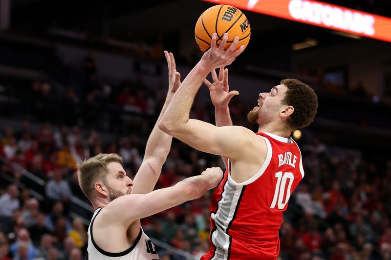 Mar 14, 2024; Minneapolis, MN, USA; Ohio State Buckeyes forward Jamison Battle (10) shoots as Iowa Hawkeyes forward Ben Krikke (23) defends during the second half at Target Center. Mandatory Credit: Matt Krohn-USA TODAY Sports