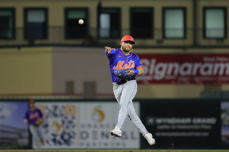 Mar 8, 2024; Jupiter, Florida, USA; New York Mets second baseman Yolmer Sanchez (83) throws to first base to retire Miami Marlins right fielder Jesus Sanchez (not pictured) during the second inning at Roger Dean Chevrolet Stadium. Mandatory Credit: Sam Navarro-USA TODAY Sports