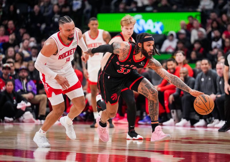 TORONTO, ON - FEBRUARY 9: Gary Trent Jr. #33 of the Toronto Raptors dribbles against Dillon Brooks #9 of the Houston Rockets during the first half of their basketball game at the Scotiabank Arena on February 9, 2024 in Toronto, Ontario, Canada. NOTE TO USER: User expressly acknowledges and agrees that, by downloading and/or using this Photograph, user is consenting to the terms and conditions of the Getty Images License Agreement. (Photo by Mark Blinch/Getty Images)