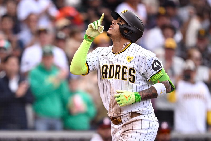 Sep 18, 2024; San Diego, California, USA; San Diego Padres third baseman Manny Machado (13) celebrates after hitting a home run against the Houston Astros during the sixth inning at Petco Park. Mandatory Credit: Orlando Ramirez-Imagn Images