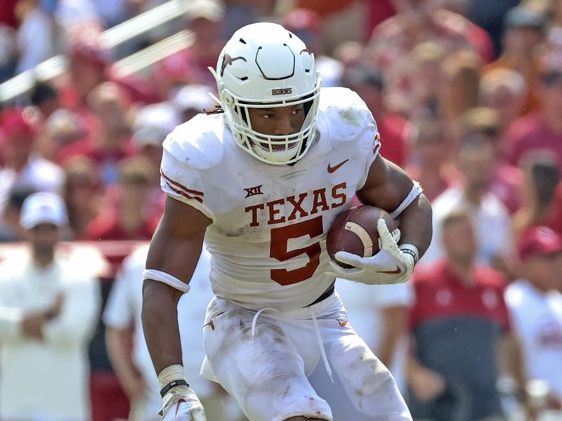 Oct 8, 2022; Dallas, Texas, USA;  Texas Longhorns running back Bijan Robinson (5) runs with the ball during the game against the Oklahoma Sooners at the Cotton Bowl. Mandatory Credit: Kevin Jairaj-USA TODAY Sports