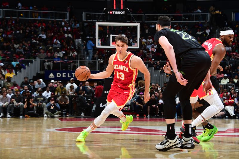 ATLANTA, GA - MARCH 10: Bogdan Bogdanovic #13 of the Atlanta Hawks dribbles the ball during the game against the New Orleans Pelicans on March 10, 2024 at State Farm Arena in Atlanta, Georgia.  NOTE TO USER: User expressly acknowledges and agrees that, by downloading and/or using this Photograph, user is consenting to the terms and conditions of the Getty Images License Agreement. Mandatory Copyright Notice: Copyright 2024 NBAE (Photo by Scott Cunningham/NBAE via Getty Images)