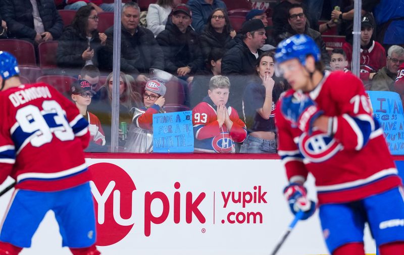 Feb 28, 2026; Montreal, Quebec, CAN; Fans watch the Montreal Canadiens during the warmup before the game against the Washington Capitals at the Bell Centre. Mandatory Credit: Eric Bolte-Imagn Images