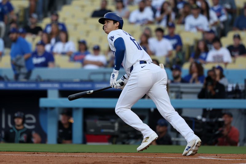 Jul 2, 2024; Los Angeles, California, USA;  Los Angeles Dodgers designated hitter Shohei Ohtani (17) hits a double during the first inning against the Arizona Diamondbacks at Dodger Stadium. Mandatory Credit: Kiyoshi Mio-USA TODAY Sports