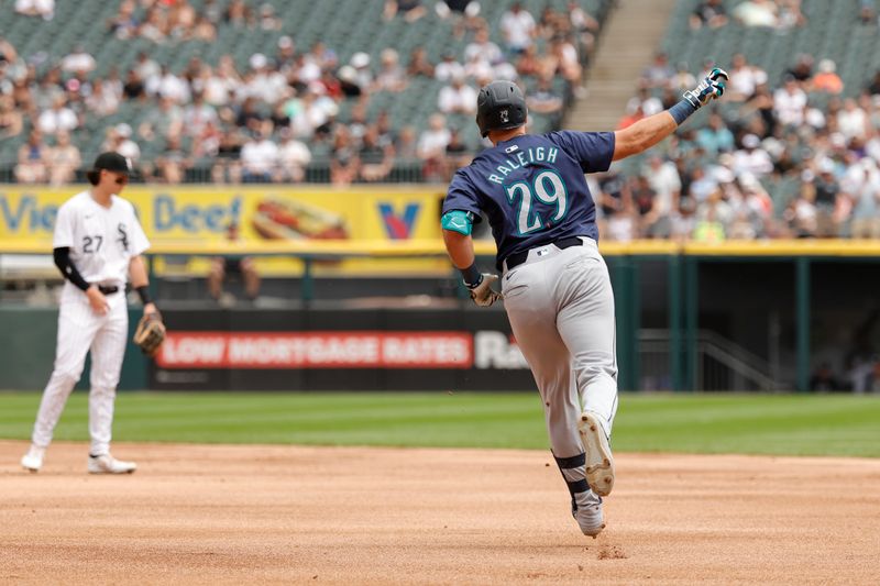 Jul 28, 2024; Chicago, Illinois, USA; Seattle Mariners catcher Cal Raleigh (29) rounds the bases after hitting a two-run home run against the Chicago White Sox during the first inning at Guaranteed Rate Field. Mandatory Credit: Kamil Krzaczynski-USA TODAY Sports