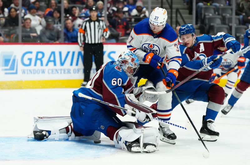 Apr 18, 2024; Denver, Colorado, USA; Colorado Avalanche defenseman Cale Makar (8) and goaltender Justus Annunen (60) defend on Edmonton Oilers left wing Warren Foegele (37) in the third period at Ball Arena. Mandatory Credit: Ron Chenoy-USA TODAY Sports