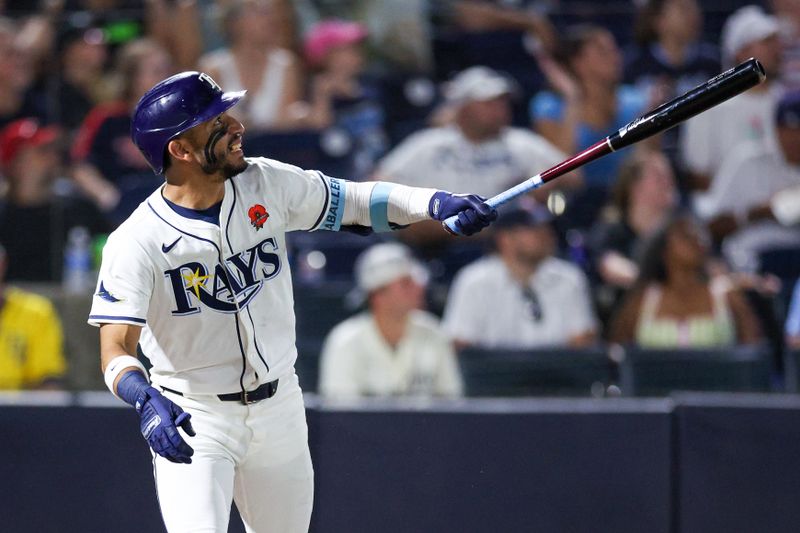 May 26, 2025; Tampa, Florida, USA; Tampa Bay Rays shortstop Jose Caballero (77) hits a two rbi double against the Minnesota Twins in the eighth inning  at George M. Steinbrenner Field. Mandatory Credit: Nathan Ray Seebeck-Imagn Images