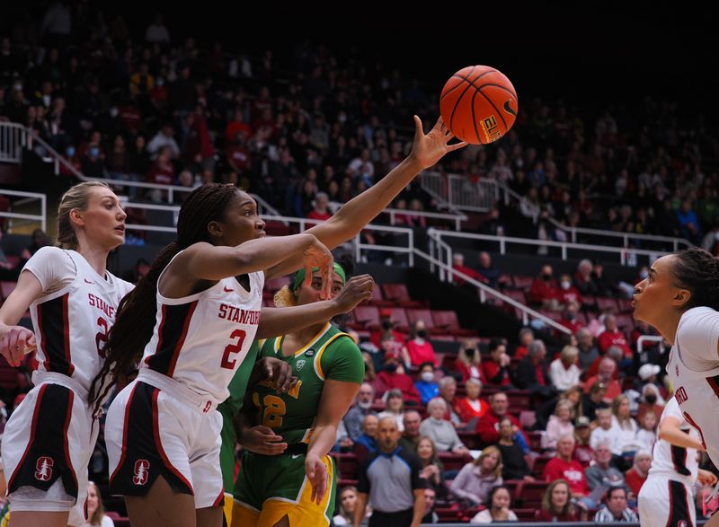 Jan 29, 2023; Stanford, California, USA; Stanford Cardinal guard Agnes Emma-Nnopu (2) controls a rebound against Oregon Ducks guard Te-Hina Paopao (12) during the first quarter at Maples Pavilion. Mandatory Credit: Kelley L Cox-USA TODAY Sports