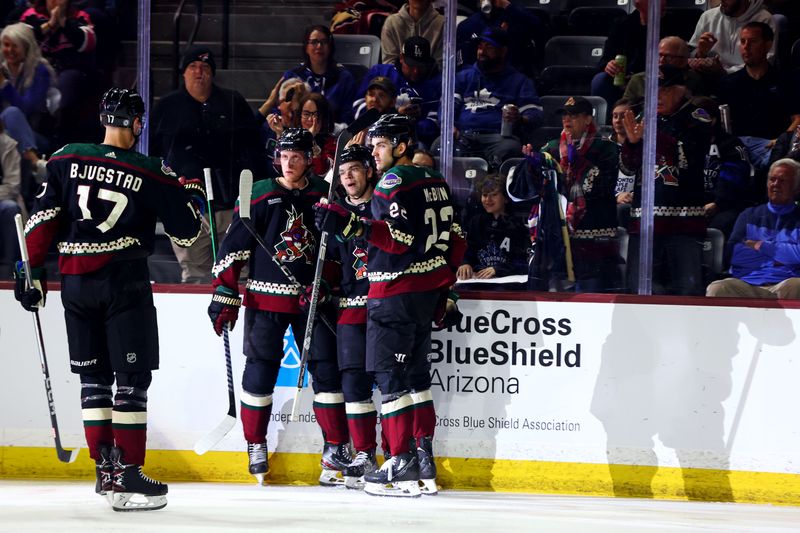 Feb 21, 2024; Tempe, Arizona, USA; Arizona Coyotes left wing Matias Maccelli (63) celebrates with his teammates after scoring a goal during the second period against the Toronto Maple Leafs at Mullett Arena. Mandatory Credit: Mark J. Rebilas-USA TODAY Sports